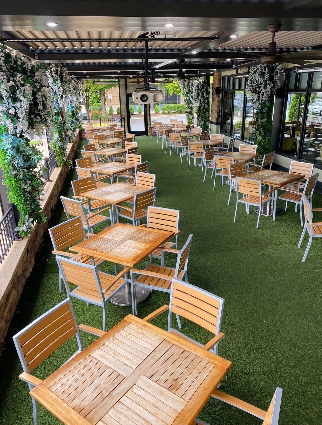 Rows of wood tables on Rockwood's covered patio in Gainesville VA